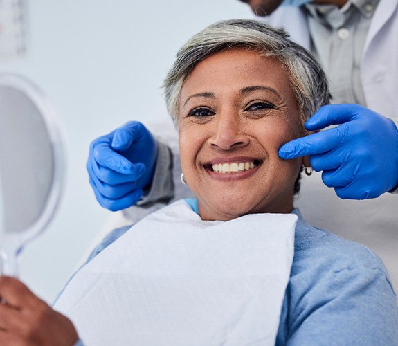 Woman smiling with dental implants