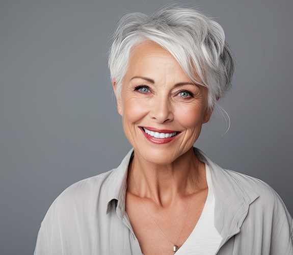 Woman smiling after completing cosmetic treatment