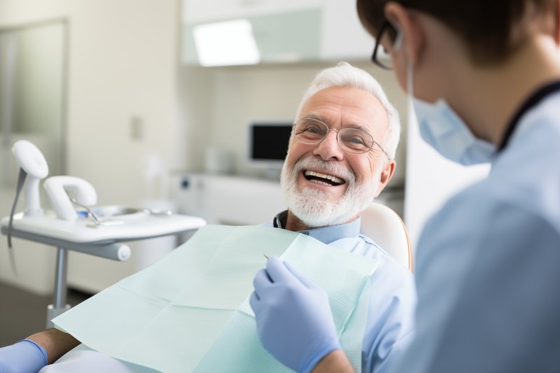 older man seeing a dentist for a checkup